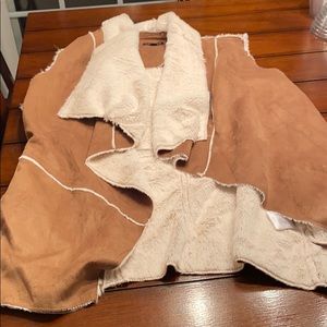 Tan vest with white lining